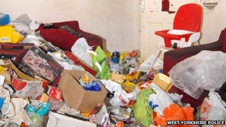 The rubbish-strewn living room in Amanda Hutton's house