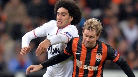 Manchester United FC's Marouane Fellaini vies with FC Shakhtar's Tomas Hubschman (right)