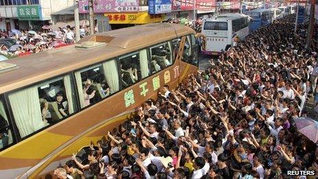 Parents see off children for college exam in China