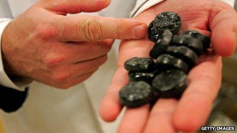 Man shows off liquorice in his Dutch factory