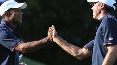 Tiger Woods (left) celebrates with Matt Kuchar