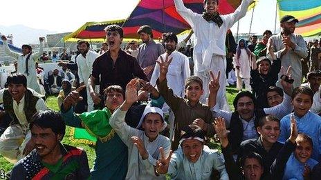 Afghanistan fans, watching on a big screen in Kabul, celebrate their team reaching the World Cup for the first time