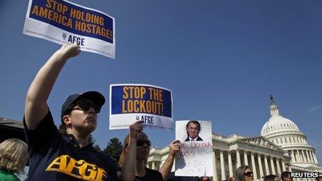 Federal workers at a rally to demand a vote to end the government shutdown, outside the Capitol in Washington DC on 4 October