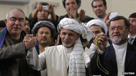 Ashraf Ghani Ahmadzai, former chairman of the Afghan Transition Coordination Commission, alongside his two vice-presidential candidates Abdul Rashid Dostum Uzbek ledar ( L) and Sarwar Danish (R) arrives to register as a candidate for the presidential election at the Afghanistan"s Independent Election Commission (IEC) in Kabul October 6, 2013.