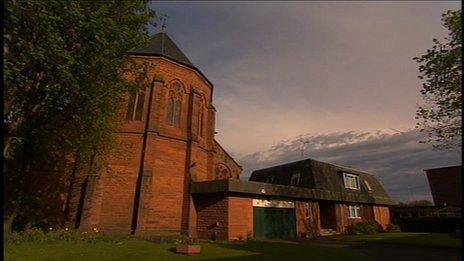 The parish house and garage were next door to the church