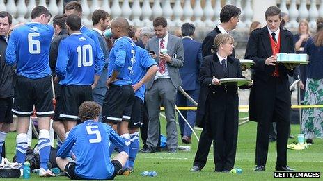 Palace staff serve refreshments at half-time