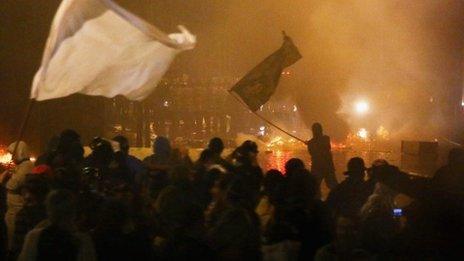 Protesters in front of police during a mostly peaceful protest by teachers and supporters calling for better public education and services in Rio de Janeiro, Brazil (7 October 2013)