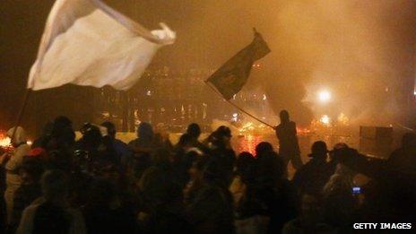 Protesters in front of police during a mostly peaceful protest by teachers and supporters calling for better public education and services in Rio de Janeiro, Brazil (7 October 2013)