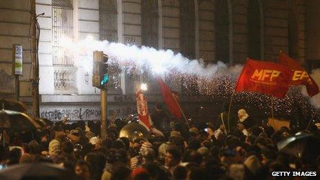 An incendiary device is fired toward a government building during a protest by teachers and supporters calling for better public education and services on 7 October 2013 in Rio de Janeiro