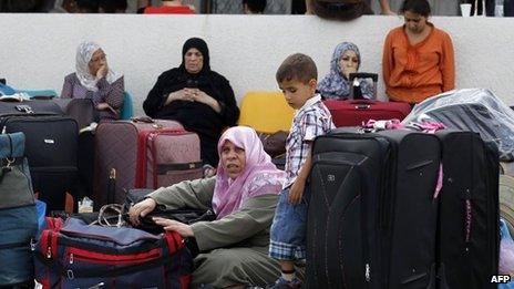 Palestinians wait by the Rafah border terminal in Gaza (August 2013)