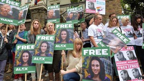 People with banners outside the Russian Embassy in London