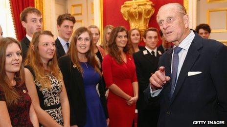 The Duke of Edinburgh speaks with a group of young people during a reception to celebrate the 500th anniversary of his "Duke of Edinburgh Award"