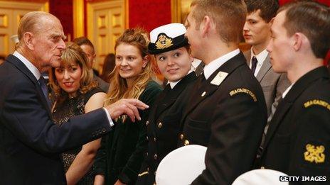 The Duke of Edinburgh speaks with a group of young people during a reception to celebrate the 500th anniversary of his "Duke of Edinburgh Award"