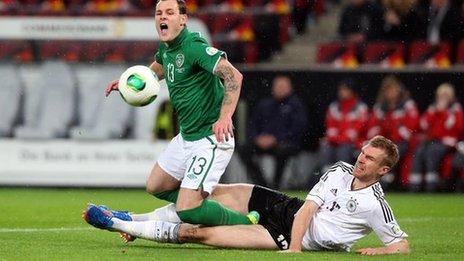 Anthony Stokes is tackled by Germany's Per Mertesacker