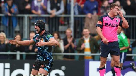 Cardiff's Harry Robinson (right) looks on as Exeter's Dean Mumms celebrates a try