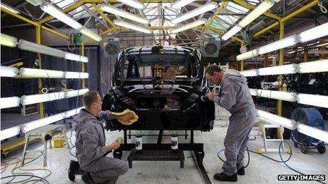 A black cab being produced