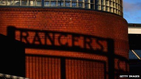 The shadow of the gates at Ibrox