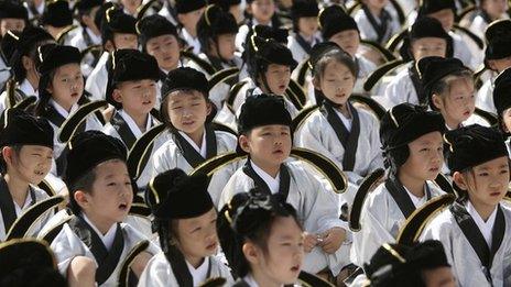 Chinese schoolchildren wearing traditional costumes