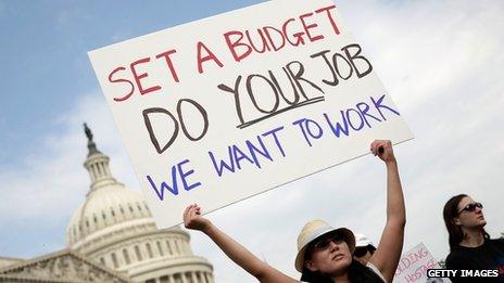 A furloughed federal worker protested outside the US Capitol on 4 October