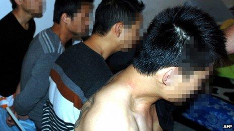 Suspected members of a gang allegedly smuggling (trafficking) Chinese migrants into Europe and the United States