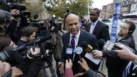 Cory Booker outside a voting station in Newark 16 October 2013