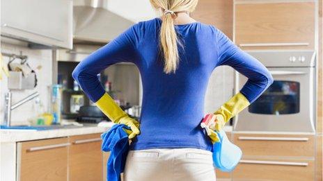 Woman contemplating housework