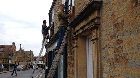 Painters transforming shops in Sherborne ahead of the filming