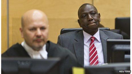 Kenya's Deputy President William Ruto (R) reacts as he sits in the courtroom before his trial at the International Criminal Court in The Hague (10 September 2013)