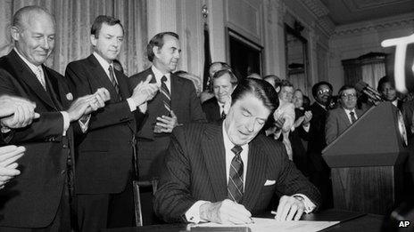 Ronald Reagan, pictured with congressional lawmakers on 30 June 1982