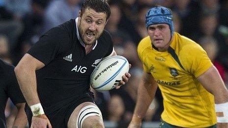 New Zealand flanker Jeremy Thrush charges through a tackle as Australia captain James Horwill looks on