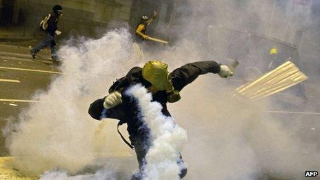 Demonstrators clash with police after a protest for the Teachers' Day, on 15 October, 2013 in Rio de Janeiro