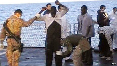 Italian navy video grab on 13 October 2013 shows immigrants frisked by crew members of a ship after being rescued from the sea off the Italian island of Lampedusa