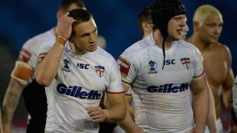 England captain Kevin Sinfield (left) shows his disappointment after his team's defeat against Italy