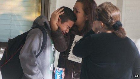 A Sparks Middle School student cries after being released from Agnes Risley Elementary School, where some students were evacuated to after a shooting in Sparks, Nevada 21 October 2013