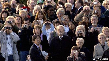 Planespotters watch the last British Airways commercial Concorde flights touch down at Heathrow airport 24 October 2003