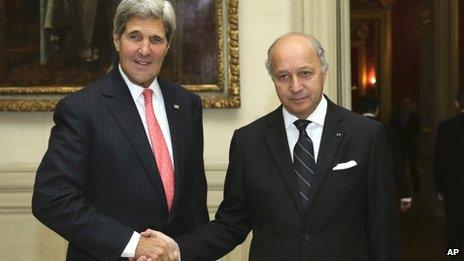 French Foreign Minister Laurent Fabius shakes hands with US Secretary of State John Kerry at the Foreign Affairs Ministry in Paris on 22 October 2013