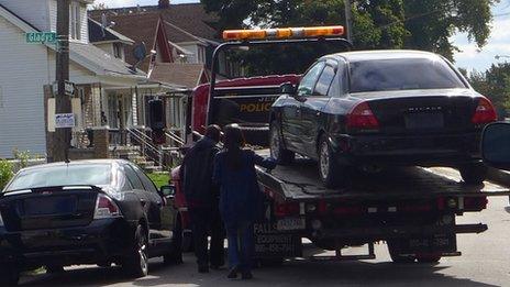 A car is towed in Detroit, Michigan