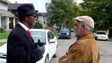 James Canty talks to car owner