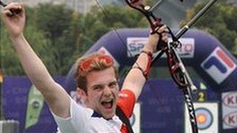 Patrick Huston celebrates after winning a gold medal at the World Archery Youth Championship in China