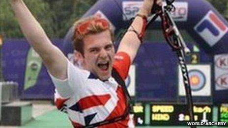 Patrick Huston celebrates after winning a gold medal at the World Archery Youth Championship in China