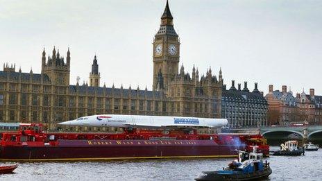 The last decommissioned Concorde sails down the River Thames, and past the Houses of Parliament, on 13 April 2004 in London, England.