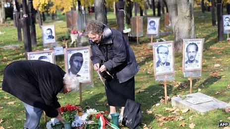 Flowers commemorate those who died in the uprising and its aftermath. 23 Oct 2013