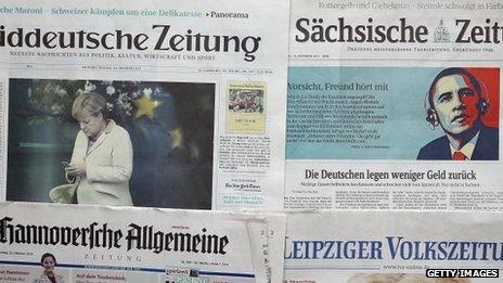 The front pages of German newspapers report the spying story