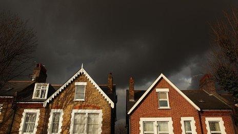 Storm clouds over rooftops in London (library image)