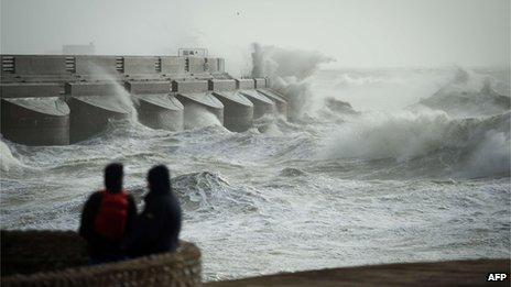 Waves crash against Brighton Marina on 27 October 2013