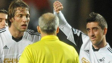 Michu and Neil Taylor make their point at the end of the game