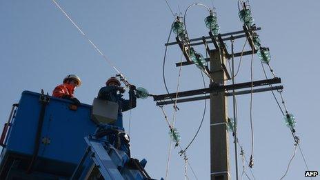 Technicians repairing power line in Pluzunet, northern France, 28 Oct 13