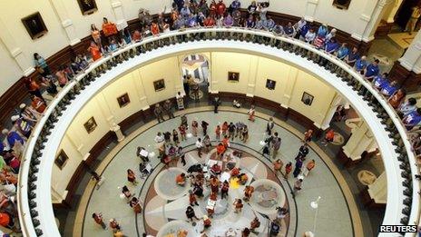 Protesters line the floors of the rotunda at the State Capitol building during a protest before the start of a special session of the Legislature in Austin, Texas 1 July 2013