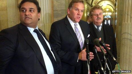 Representative Mike Rogers speaking with journalists