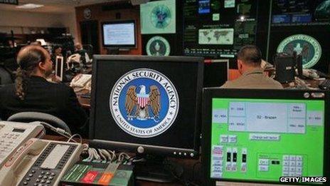 Employees sit at their stations at the NSA's Threat Operations Center.